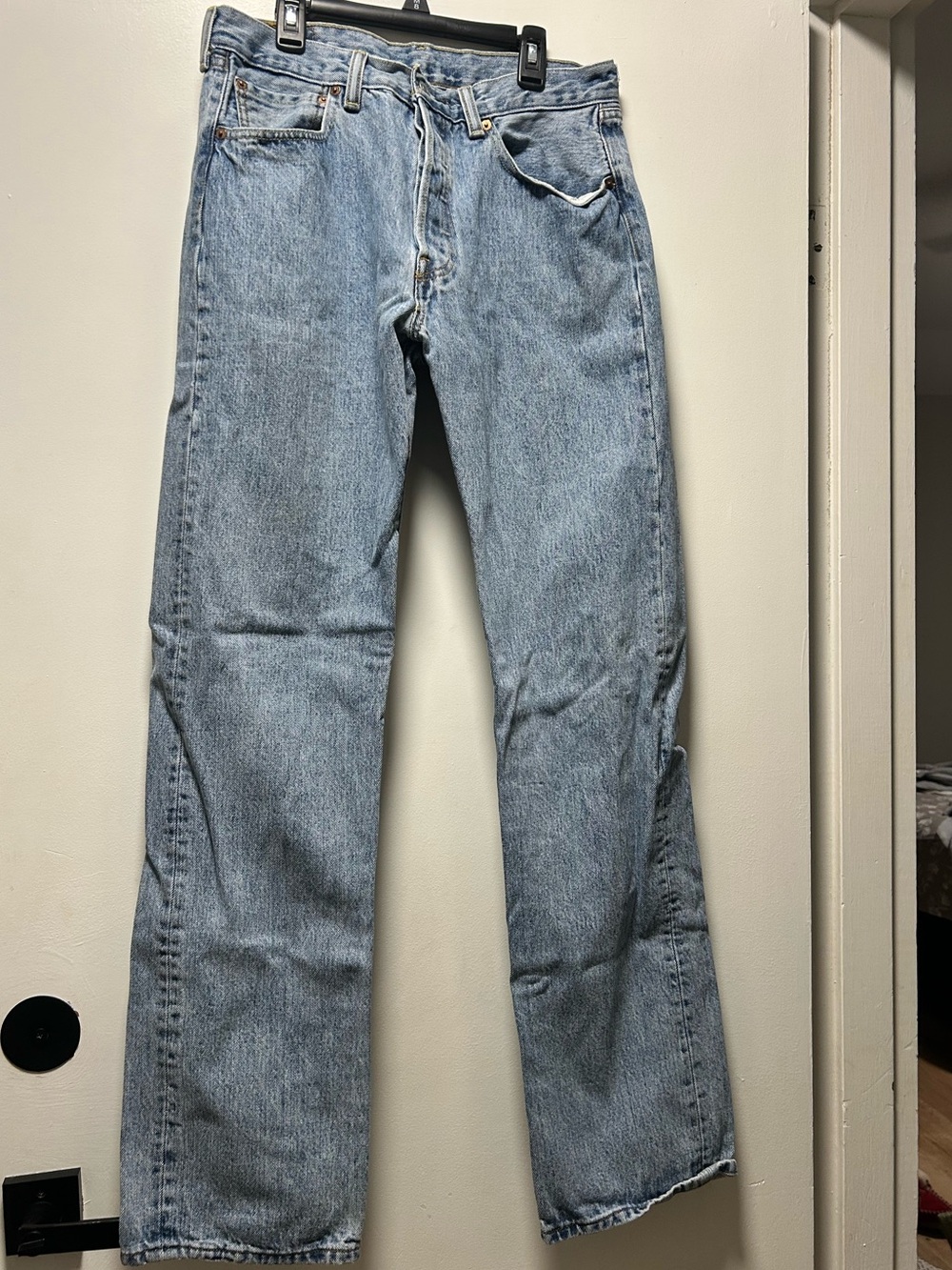 Vintage Levi's light blue/acid wash denim jeans with tan leather patch